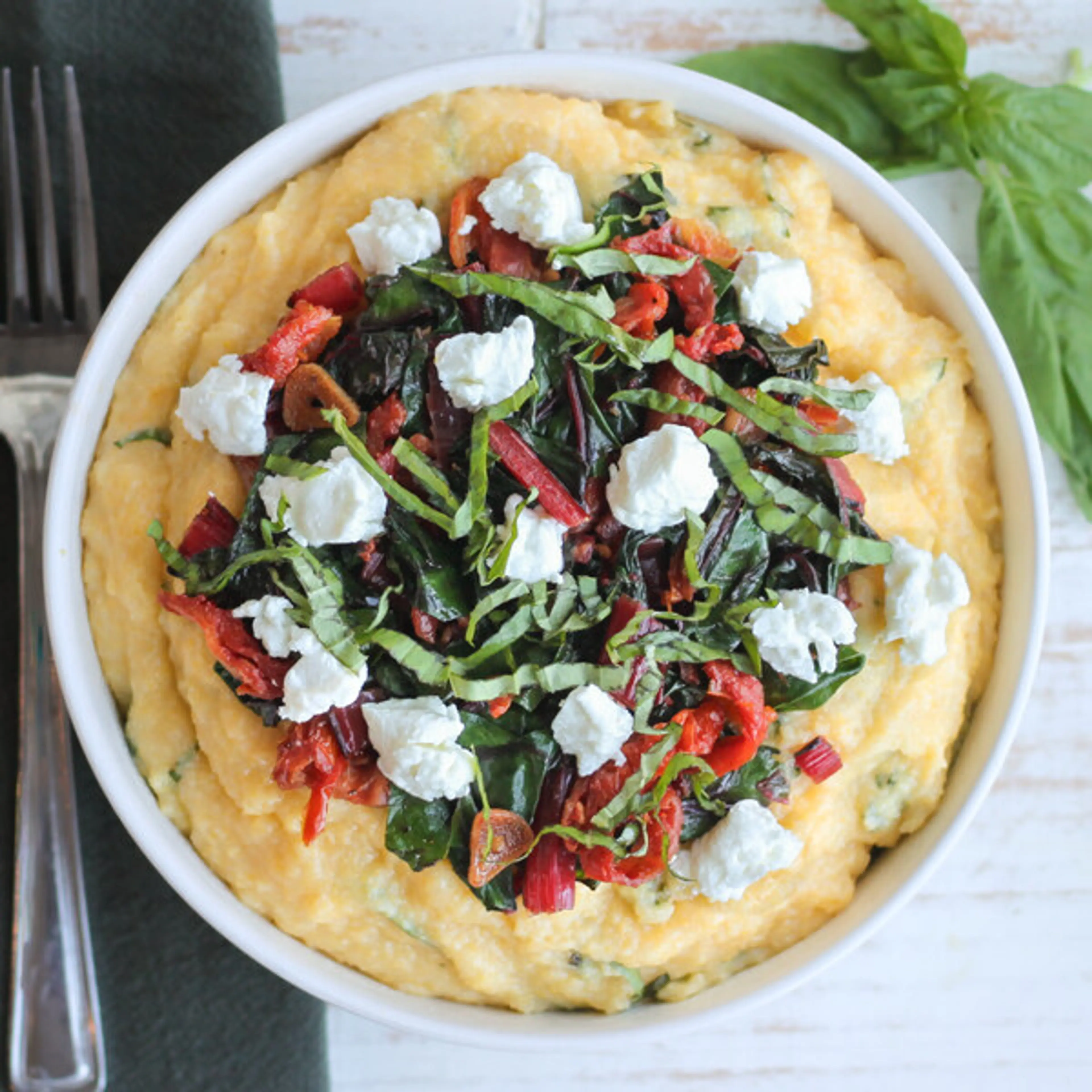 Polenta with Goat Cheese, Swiss Chard, Sun-Dried Tomatoes &