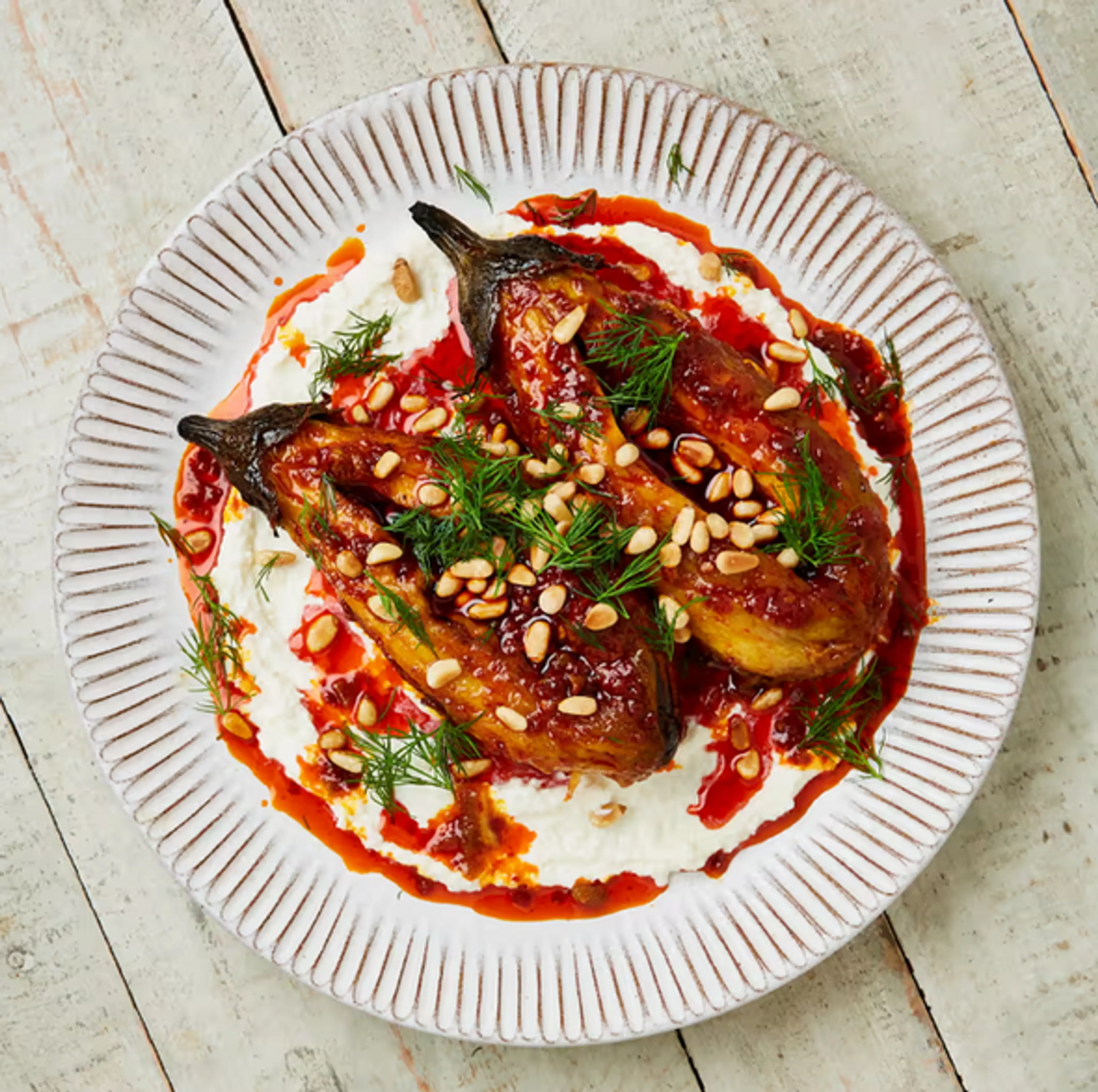Burnt aubergine (eggplant) with feta and harissa oil