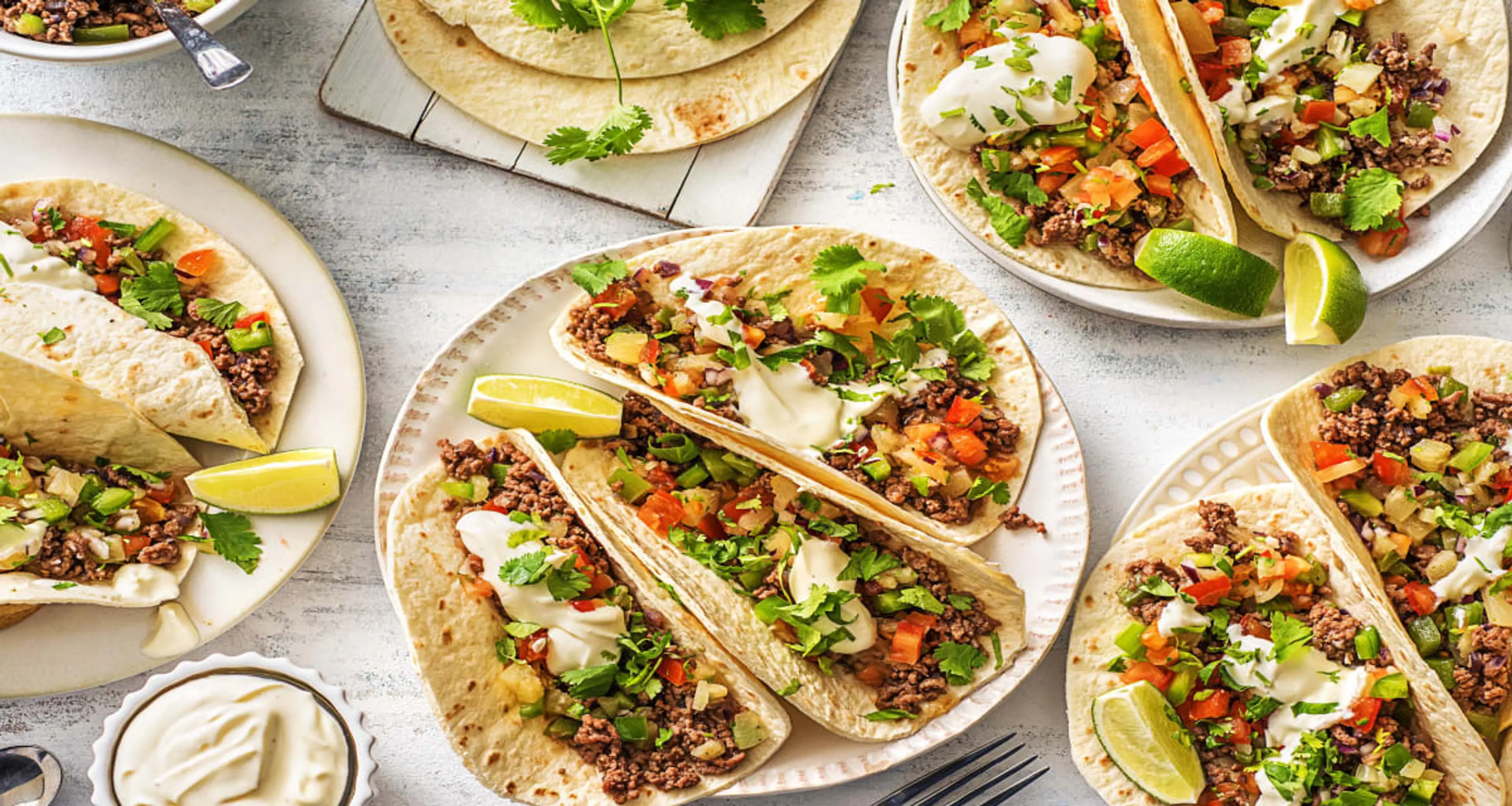 Pineapple Poblano Beef Tacos with Lime Crema, Cilantro, and