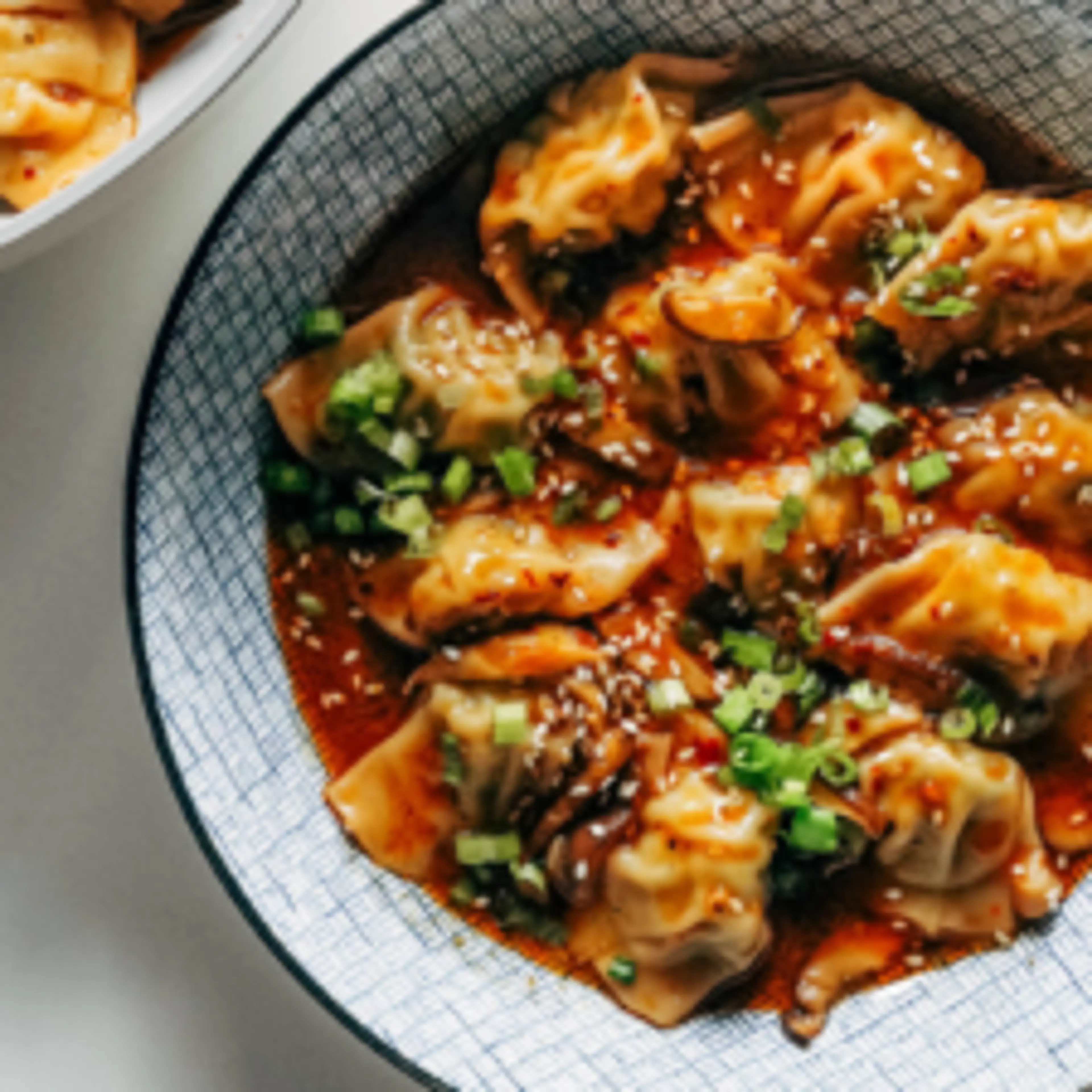 Chicken Wontons in Spicy Chili Sauce