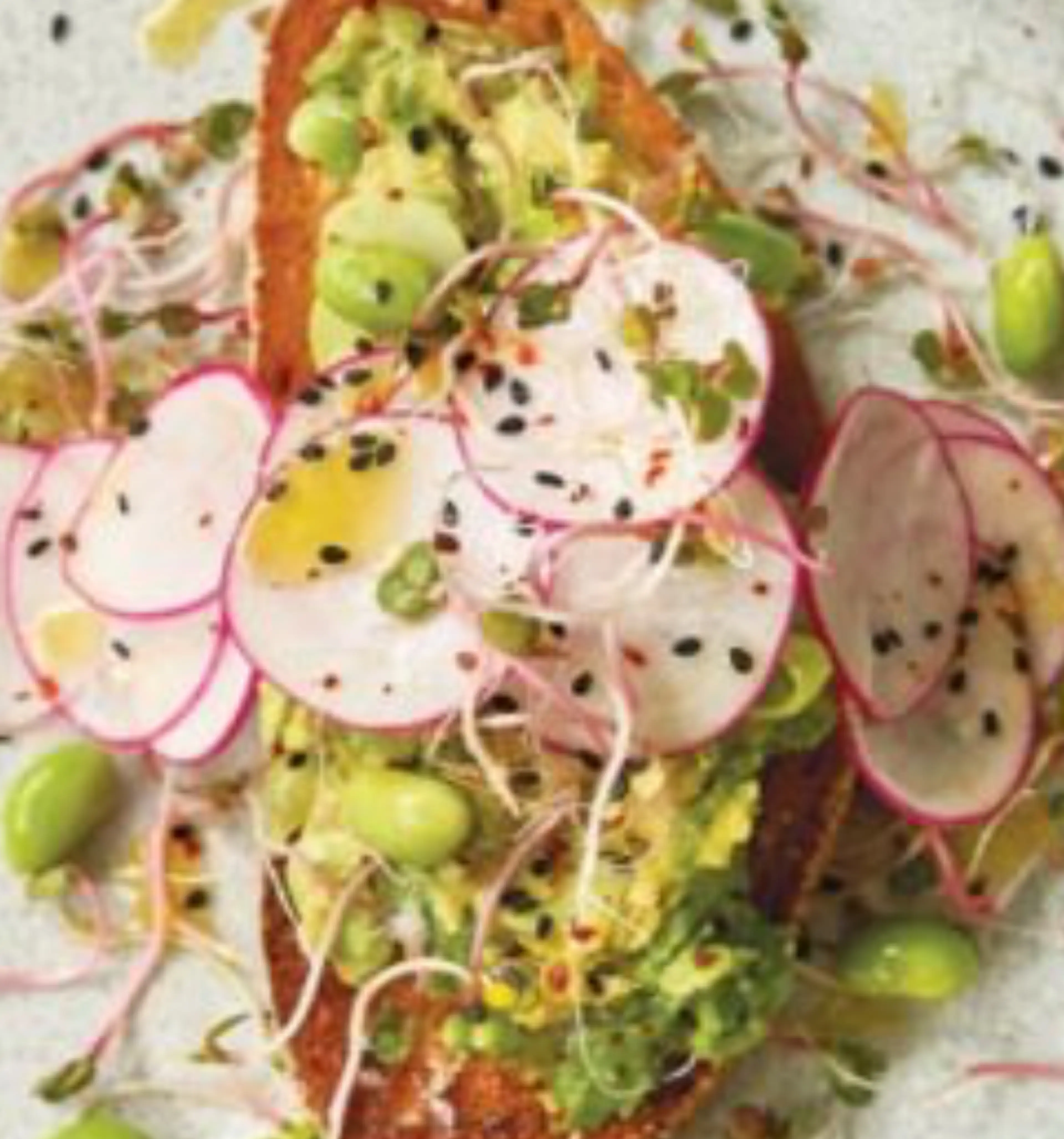 Edamame-avocado mash on garlic toast with crunchy radish
