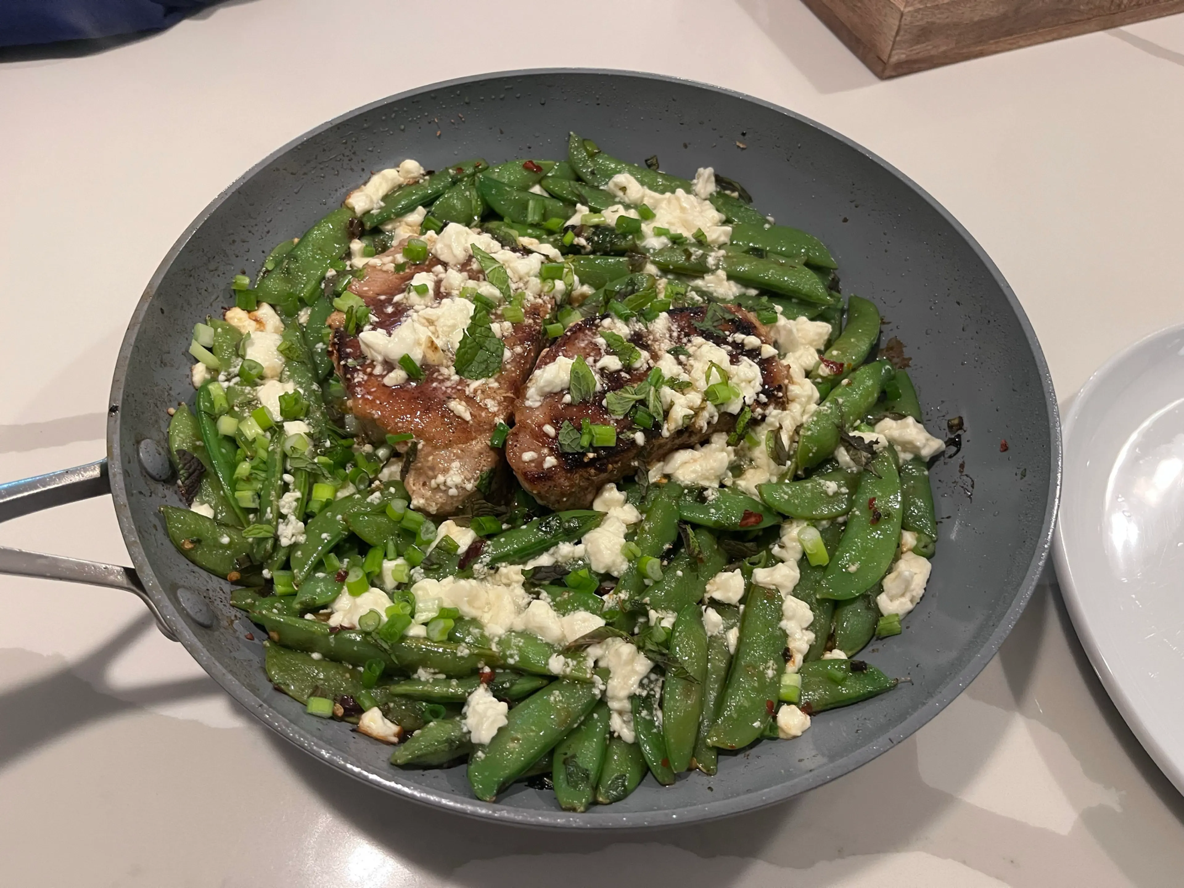 One-Pan Pork Chops With Feta, Snap Peas and Mint