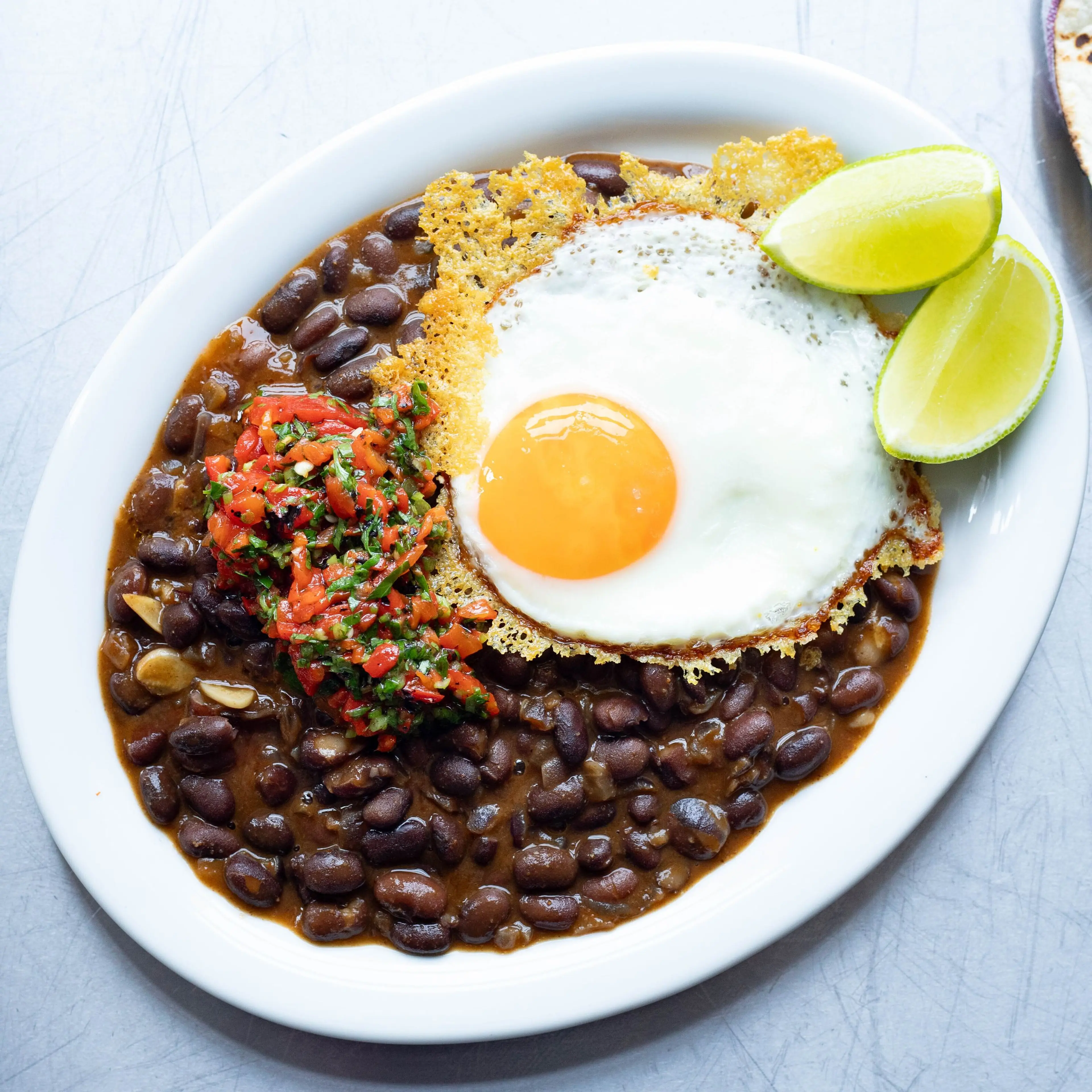 Crispy Parmesan Eggs with Black Beans & Tortillas