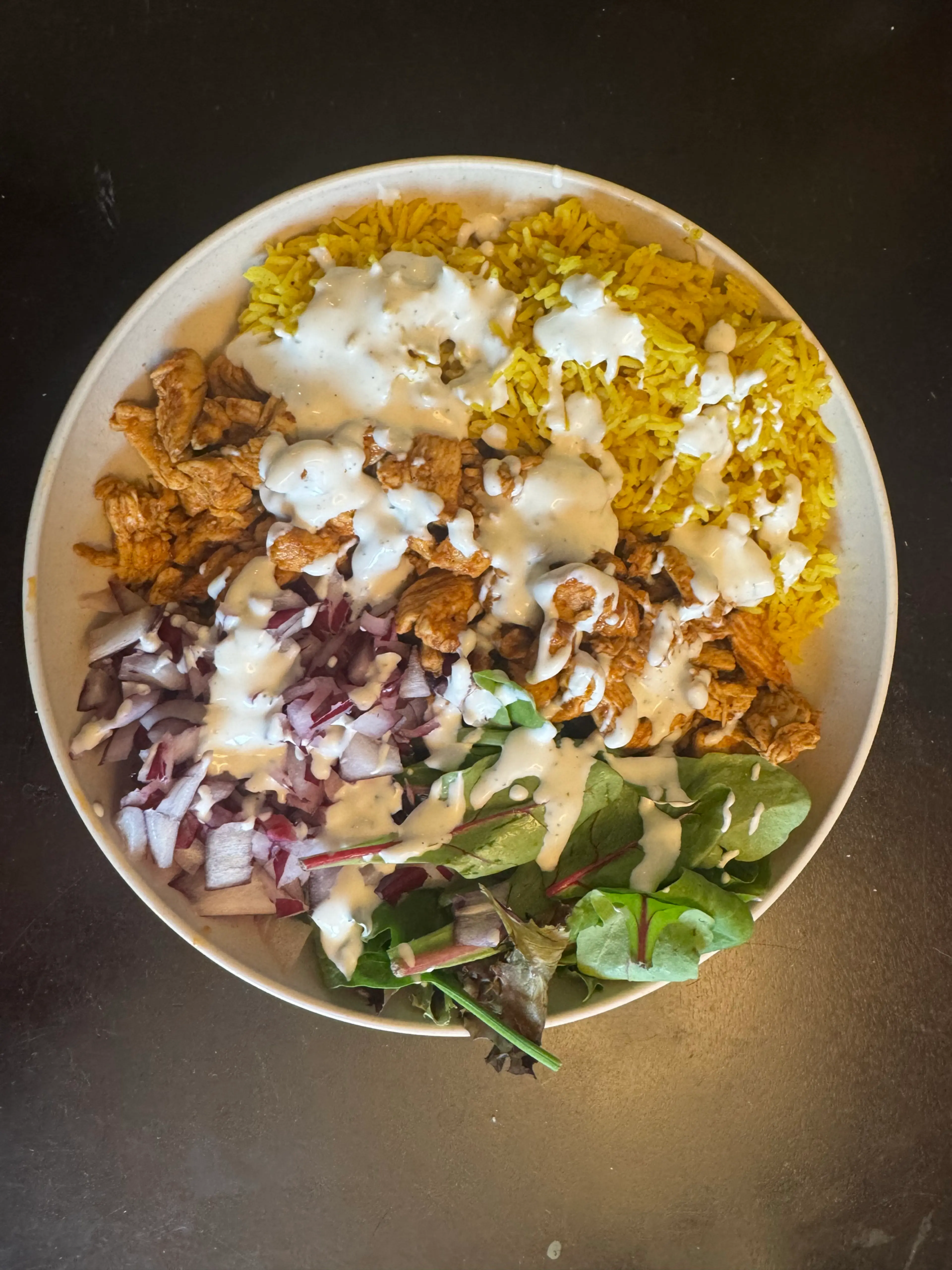 Chicken over Rice with White Sauce, Red Onions & Salad