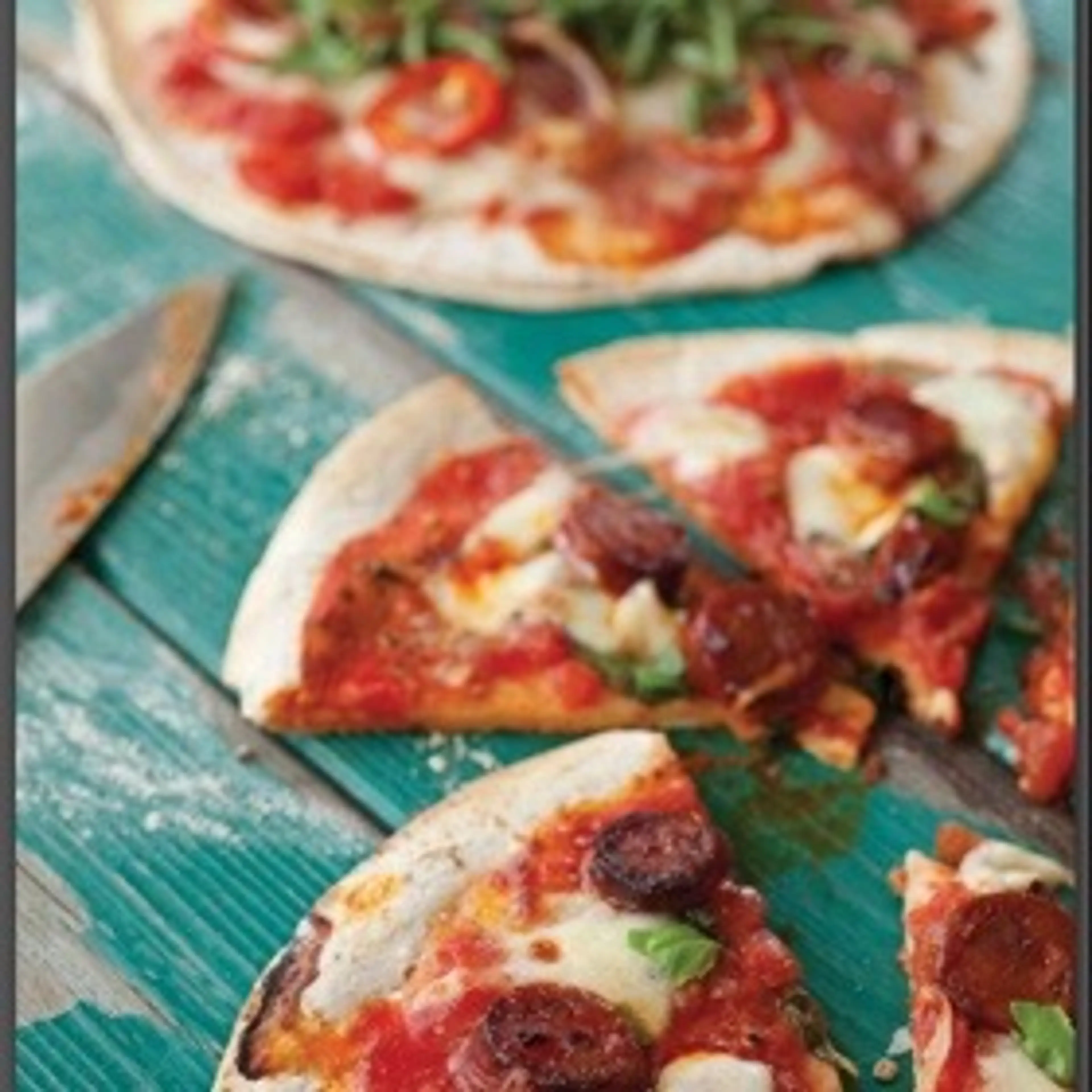 Homemade thin-crust pizzas
