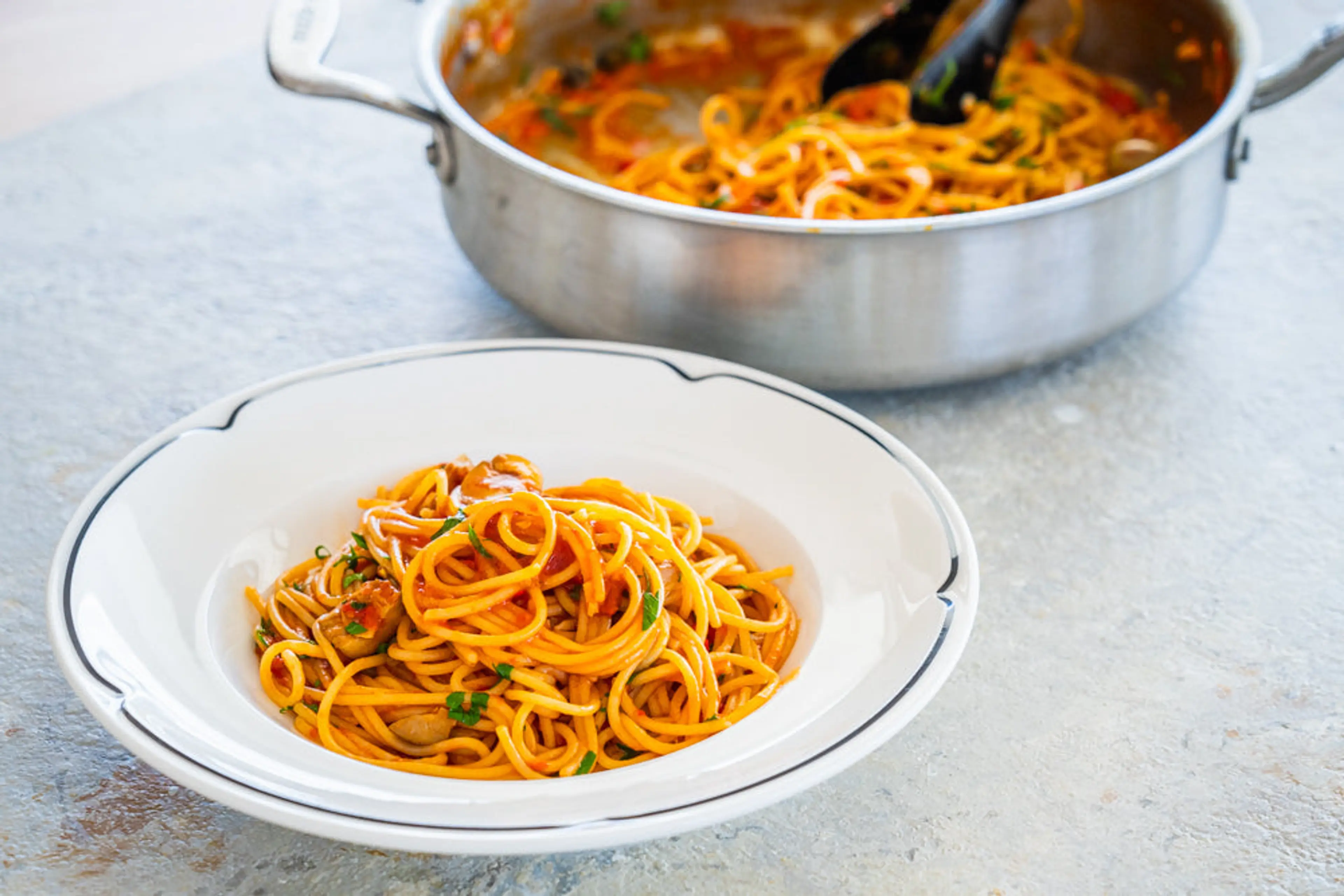 Spaghetti with tomatoes, olives, capers and chilli