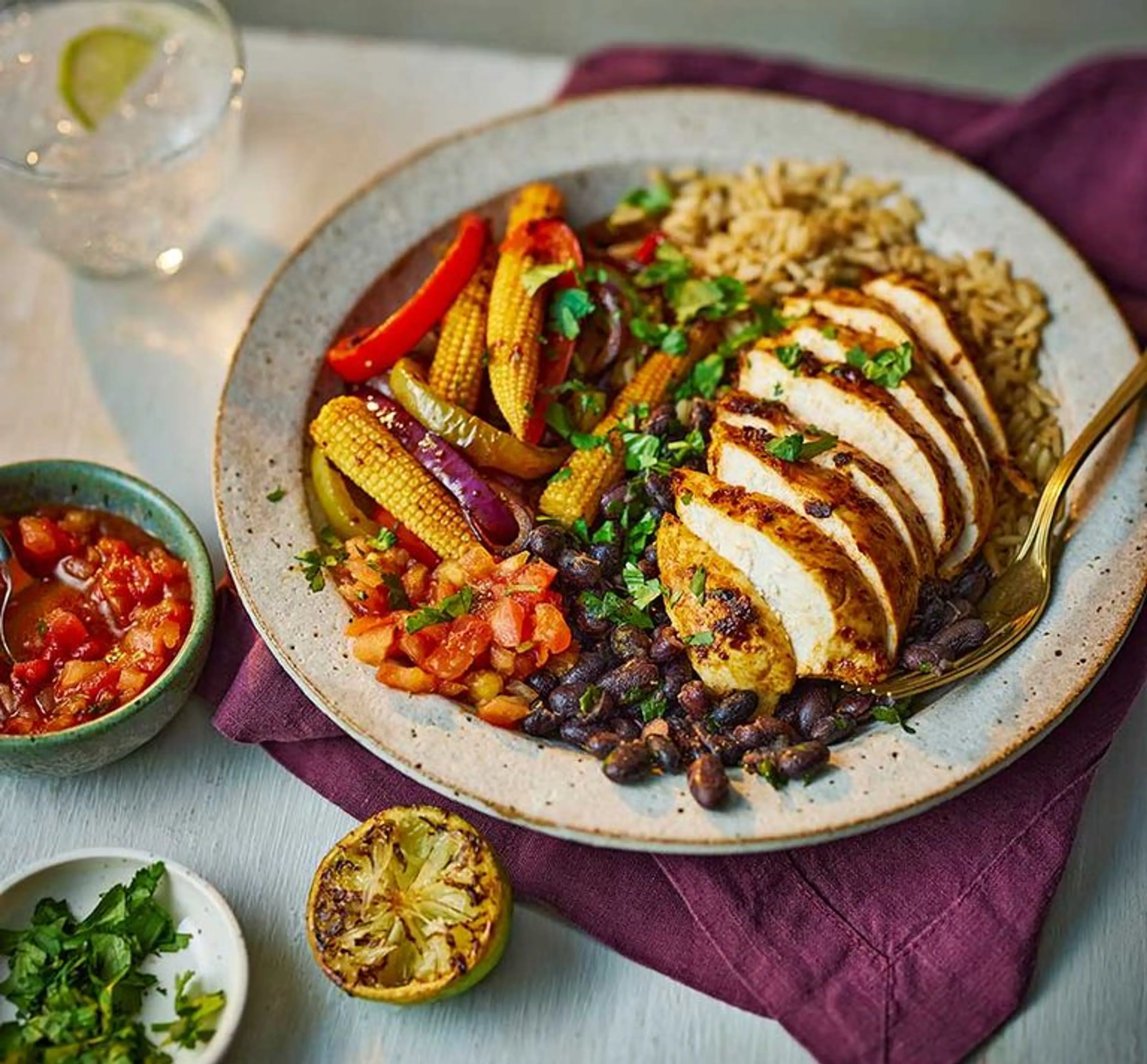 Fajita chicken rice bowl with burnt lime