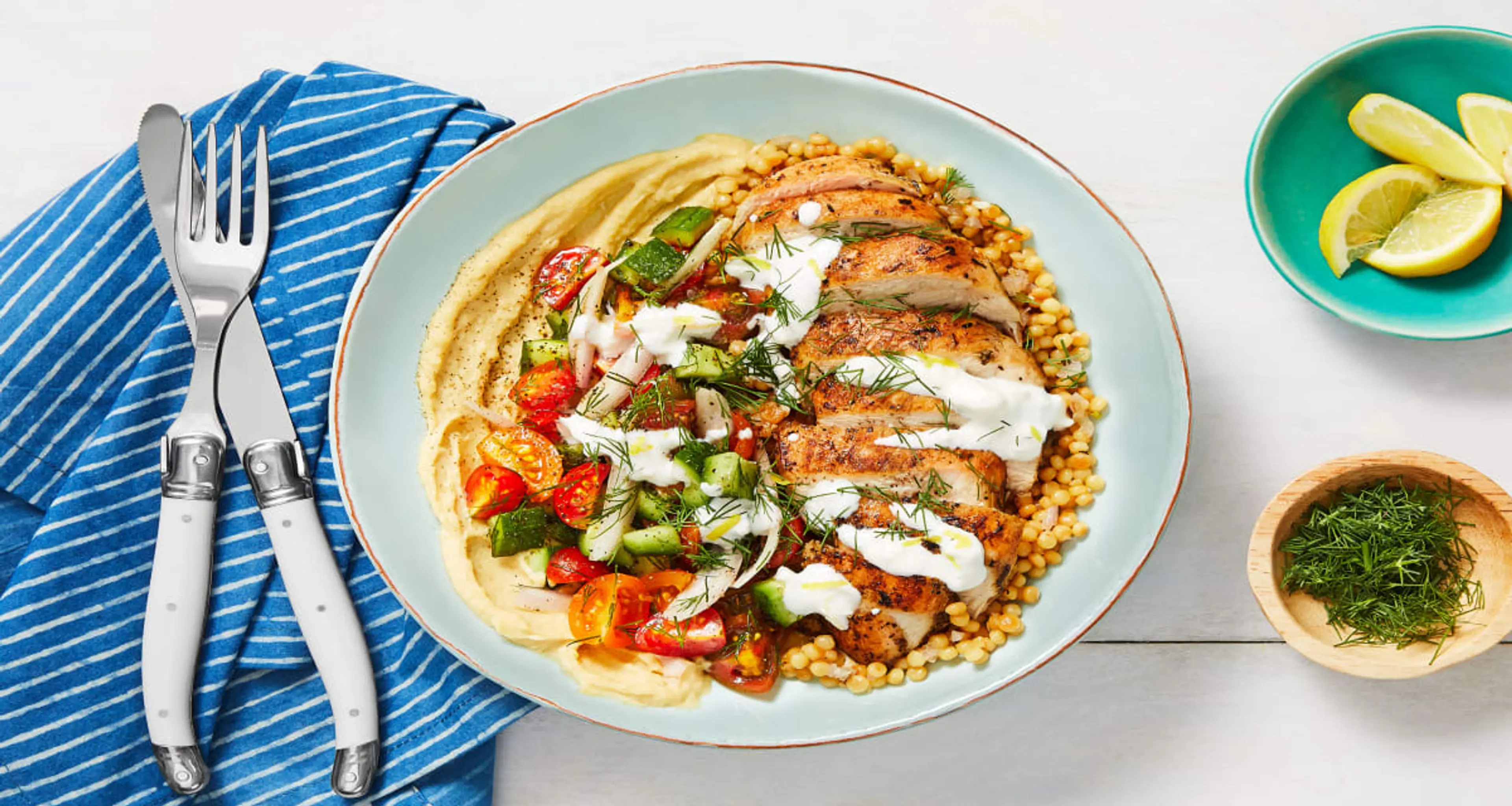 Chicken Gyro Couscous Bowls with Hummus, Tomato-Cucumber Sal