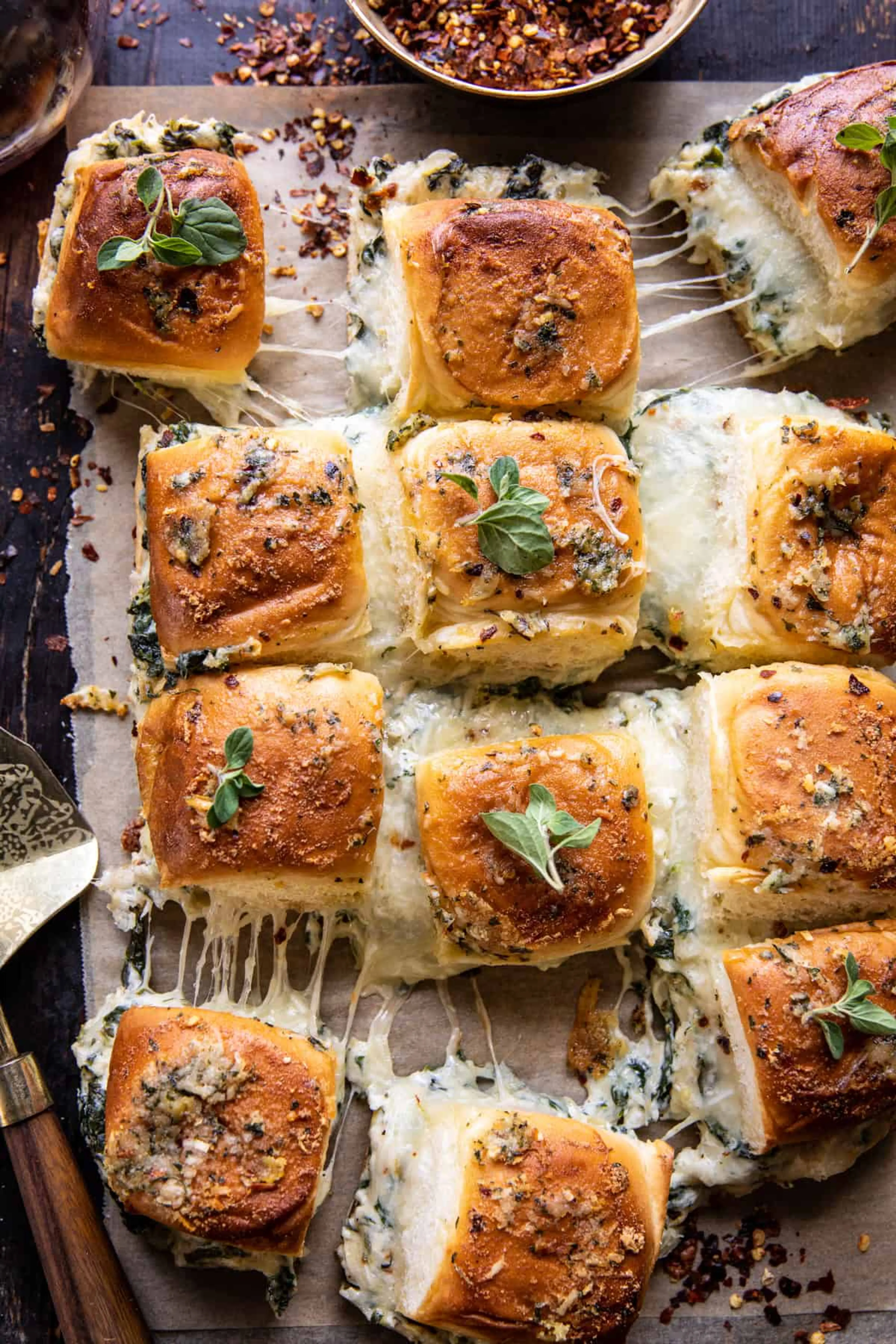 Pull Apart Roasted Garlic Spinach and Artichoke Dip Sliders