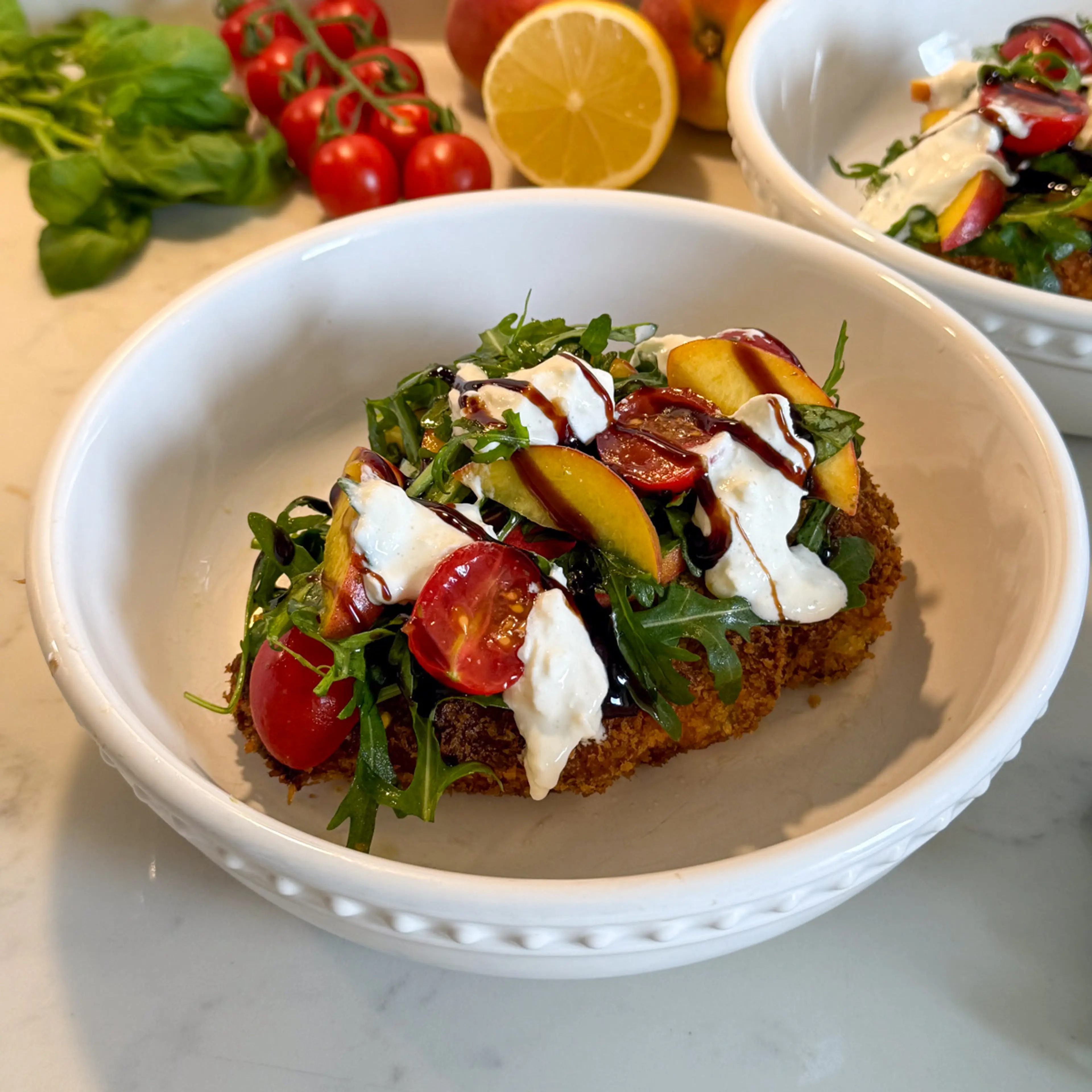 Crispy Pesto Chicken with Peach, Tomato and Burrata salad