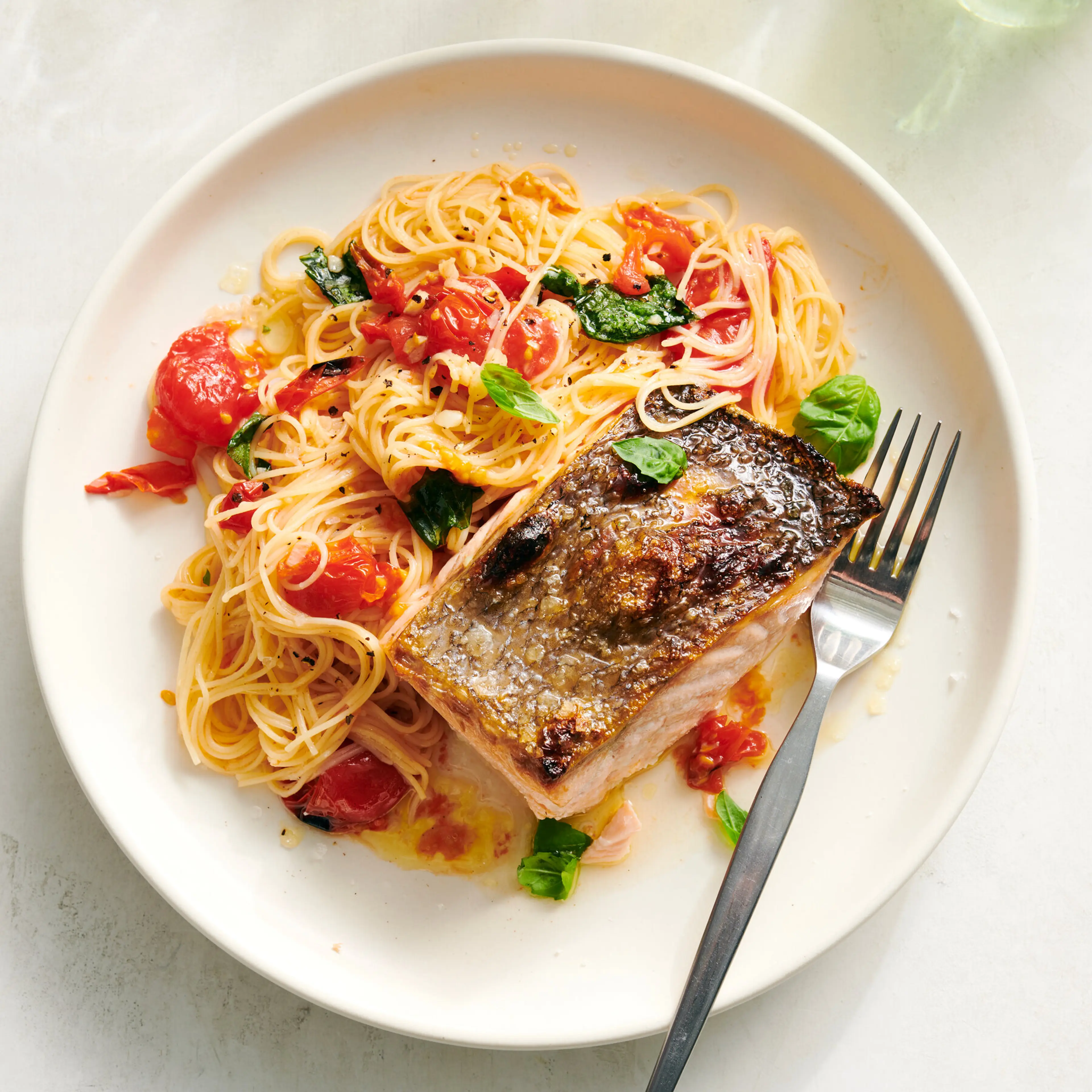 Salmon With Garlic Butter and Tomato Pasta