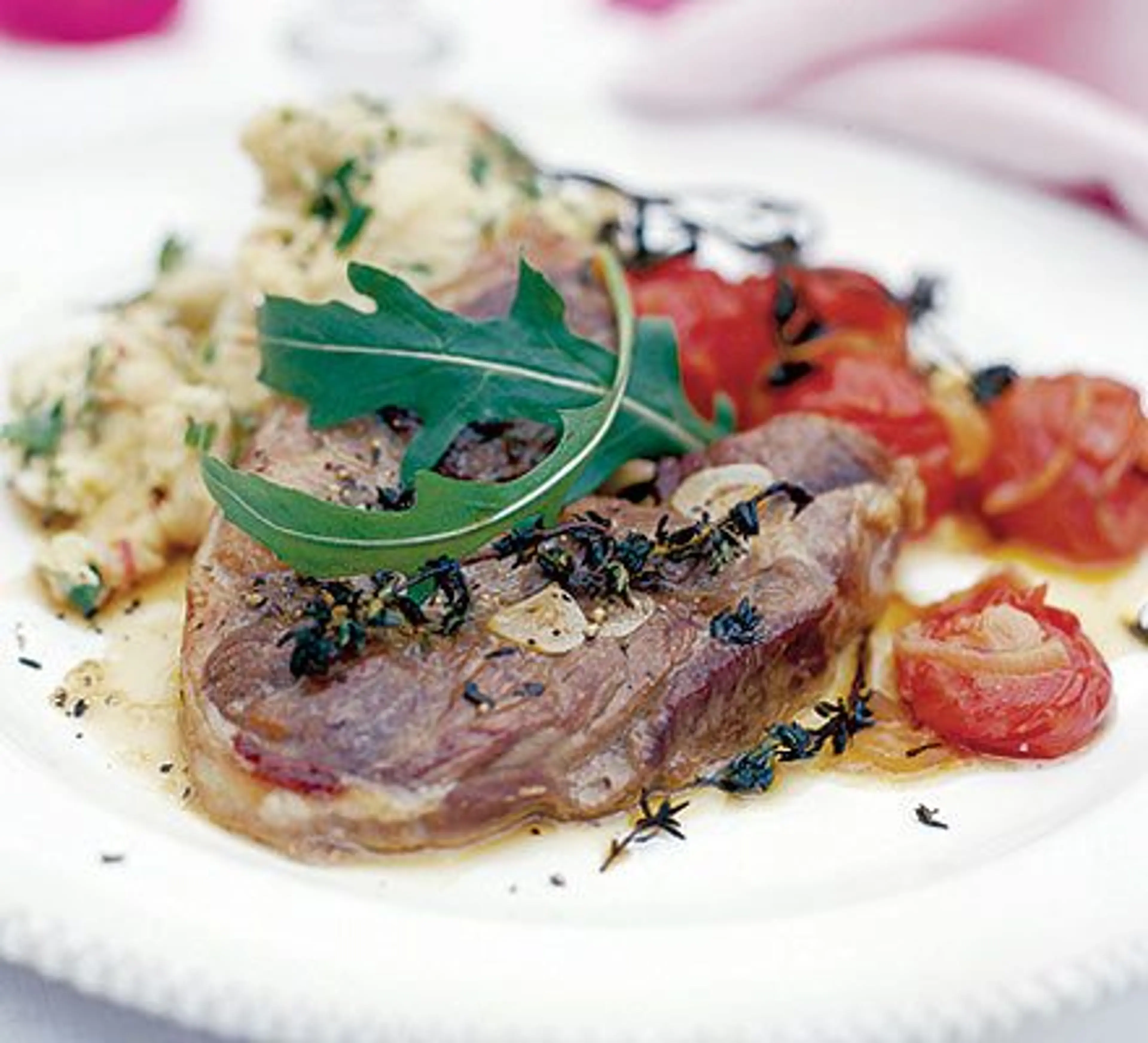 Marinated lamb steaks with paprika roast tomatoes
