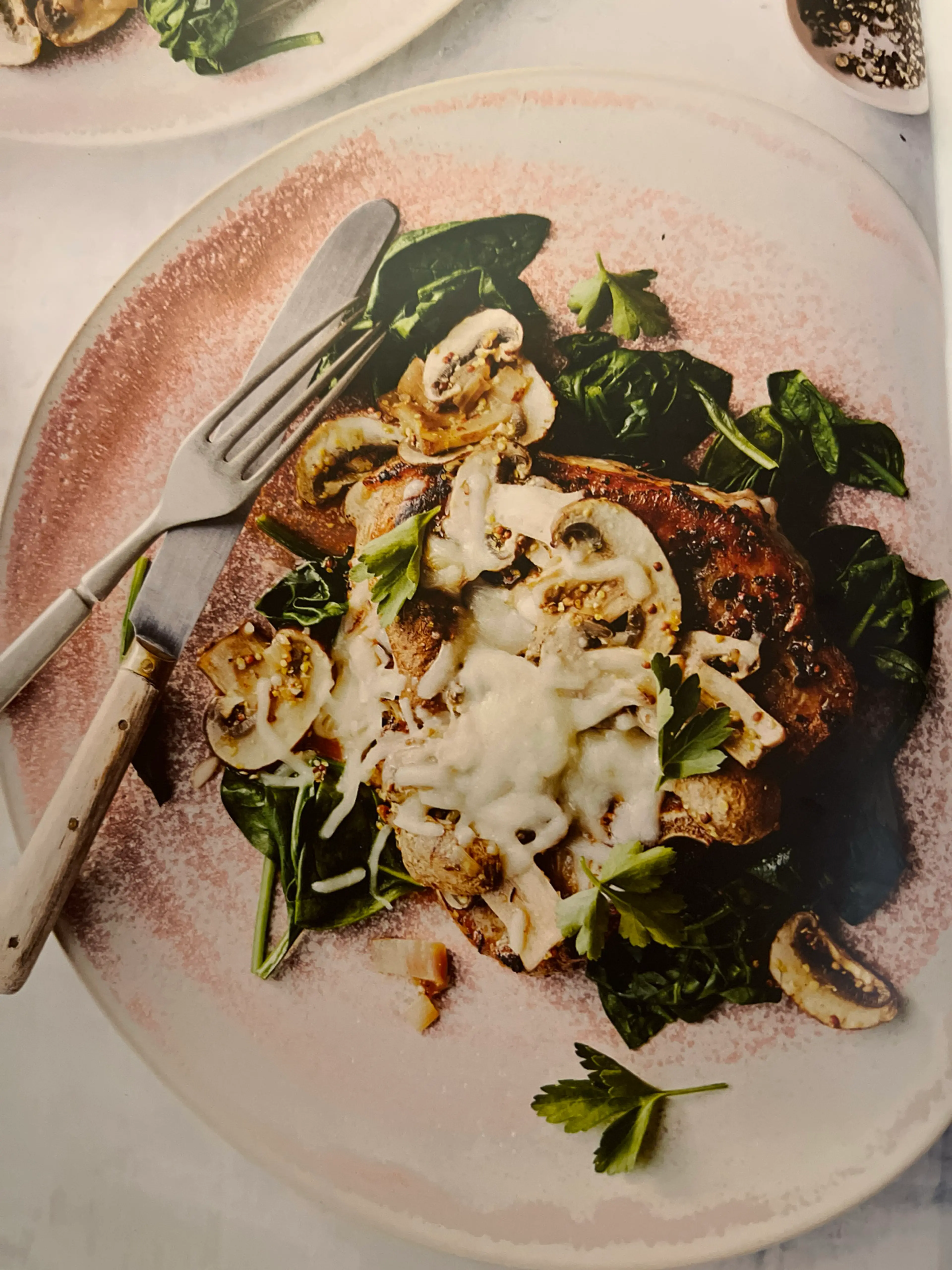 Cheesy Pork Chops with Mushrooms and Wilted Spinach