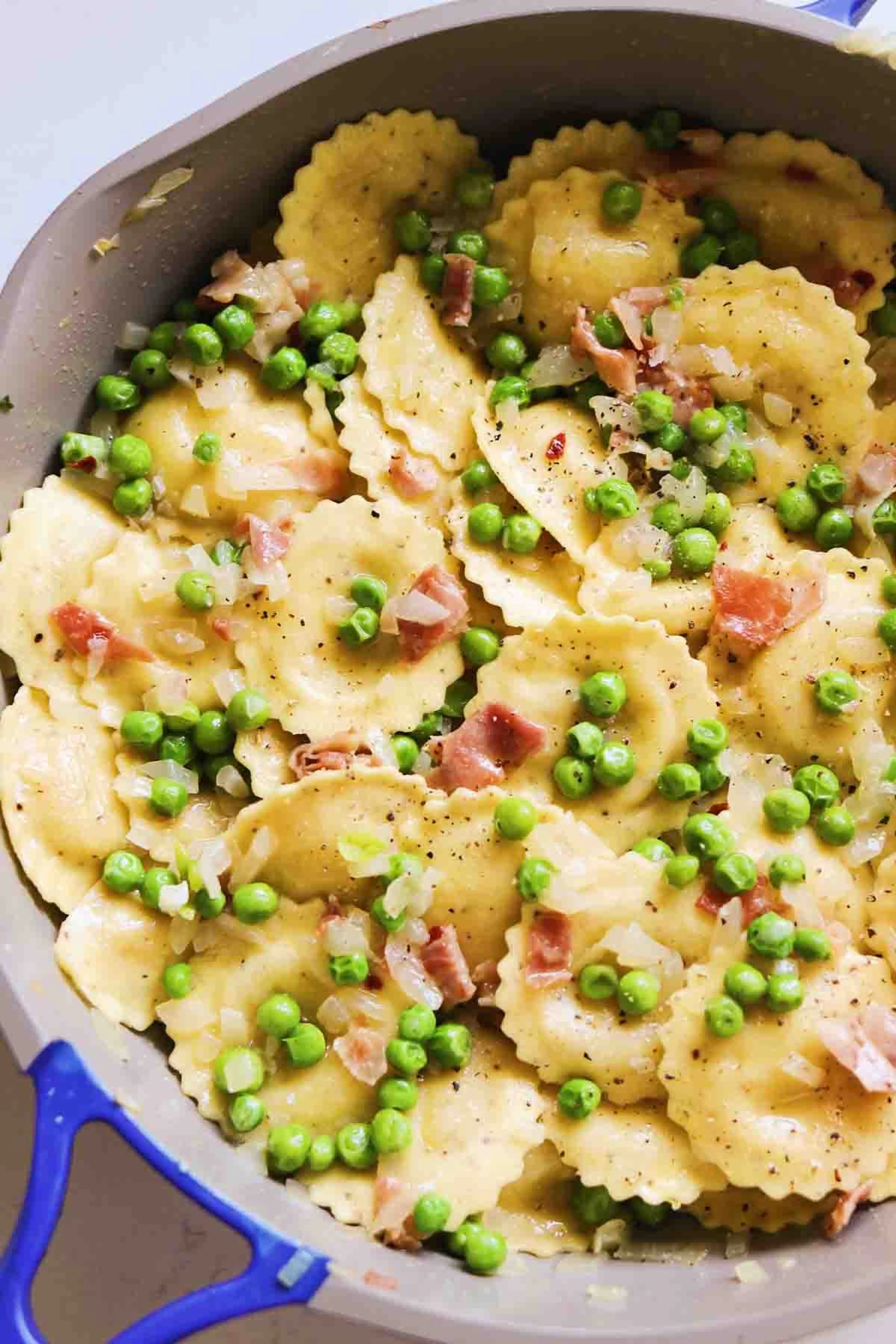 Trader Joe’s Cacio e Pepe Ravioli with peas and prosciutto